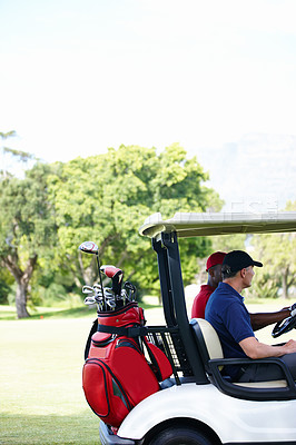 Buy stock photo Friends, bag and driving golf cart on outdoor field for search of ball, club and male people for sport or fitness. Man, athlete and side view of vehicle for moving on green grass for exercise. 