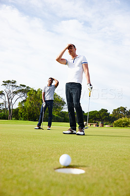Buy stock photo Men, golf course and frustrated for sports, game challenge and training for hobby in summer outdoor. Golfer, athlete or friends and upset for loss with ball on field for vacation and active on trip