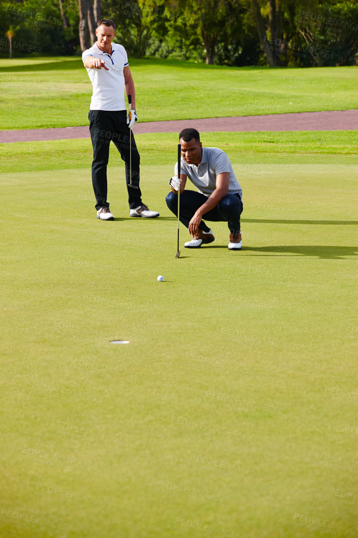 Buy stock photo Athletes, play and aim golf ball at opening for sport, fitness or competition on summer day. Men, watch and concentrate in outdoor tournament on green course for putt, par or birdie on last hole