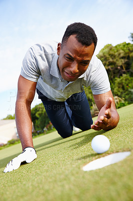 Buy stock photo Man, fail and golf ball by hole for sport, sad for disappointed with expression for loss competition. Mistake, crying and challenge with activity on grass, African athlete and lose game outdoor