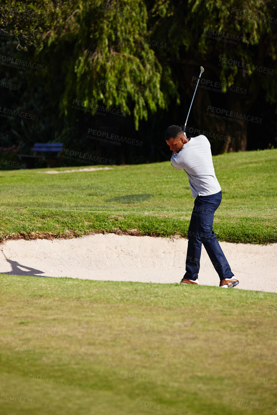 Buy stock photo Man, golfer and swing with club on sand pit for par, bogey or stroke with grass field in nature. Male person or sports player hitting ball out for strike, point or tough shot on outdoor golf course