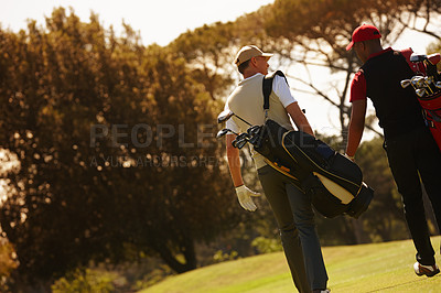 Buy stock photo Men, golf course and walking for sports, game challenge and exercise for hobby in summer travel outdoor. Golfer or friends and talk with equipment for recreation and activity for fun on vacation 