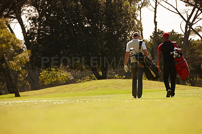 Buy stock photo Walking, friends and men together on golf course with golfing bag for training, health and teamwork. Male people, sports equipment and exercise for activity with sportswear, lawn and trees outdoor