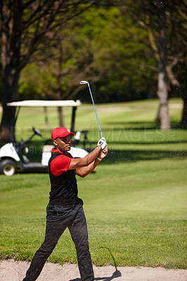 Buy stock photo Black man, golfer and swing with club in sand pit for point, score or shot by grass field in nature. African male person or sports player hitting ball out of dirt on golf course for outdoor game