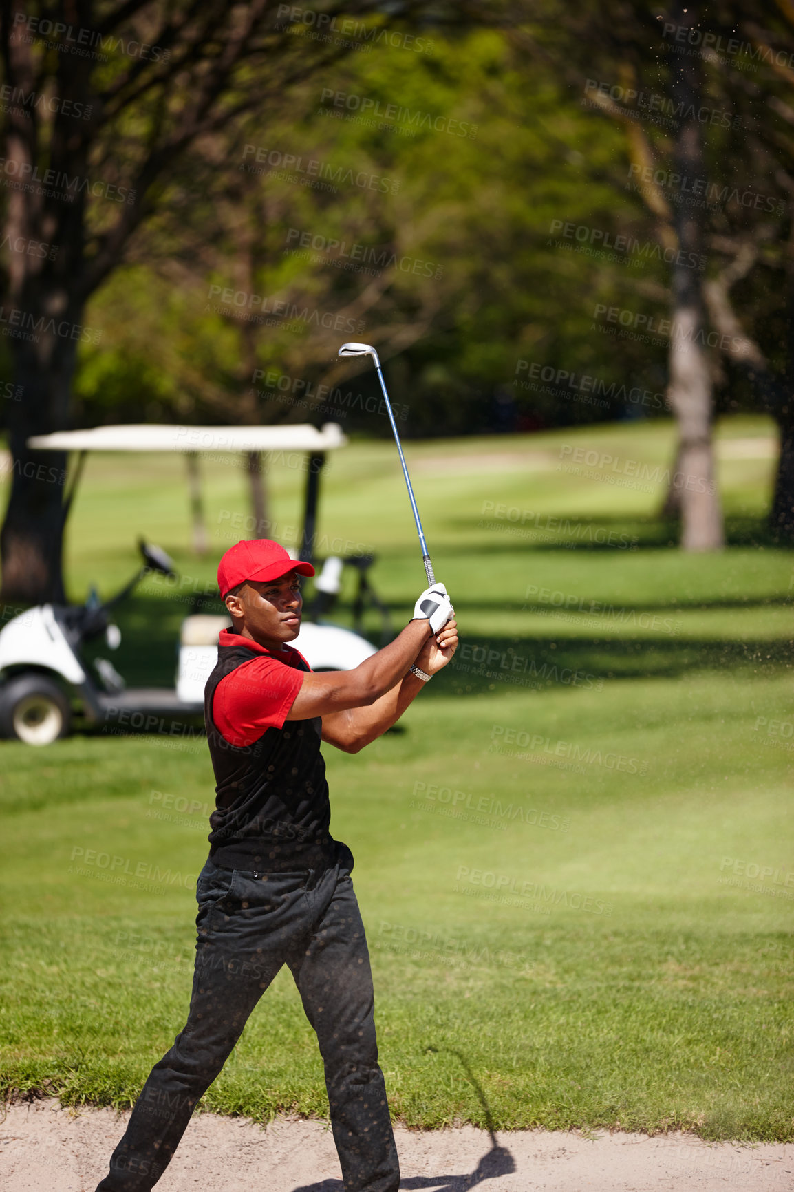 Buy stock photo Black man, golfer and swing with club in sand pit for point, score or shot by grass field in nature. African male person or sports player hitting ball out of dirt on golf course for outdoor game