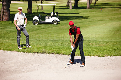 Buy stock photo Men, outdoor and play golf on summer day for sports, health or exercise in activewear ready for shot. People, training and compete in game of nine hole in activewear on natural turf ball in bunker