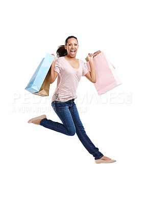 Buy stock photo Fashion, portrait and woman jump with shopping bags in studio isolated on white background mockup. Discount celebration, sales deals and happy female customer jumping with gifts after buying at mall
