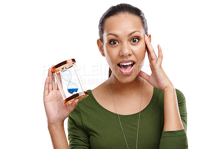 Buy stock photo Portrait, woman and holding sand hourglass with shocked gesture of limited time. Surprised, person and hands on face for countdown of business deadline with passing minute in white studio background