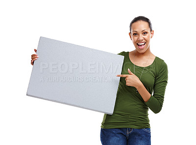 Buy stock photo Portrait, woman and pointing at poster for advertising mockup, info or news with billboard on white background. Announcement, coming soon or join us with sign for marketing, promo and ads in studio