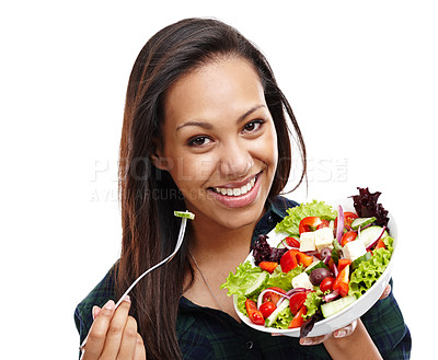 Buy stock photo Portrait of an attractive young woman enjoying a bowl of salad isolated on white