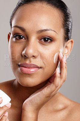 Buy stock photo Face, skin and woman with cream for beauty, container with cosmetic product and dermatology on white background. Healthy skincare in studio, glow with lotion or sunscreen for moisturizer in portrait