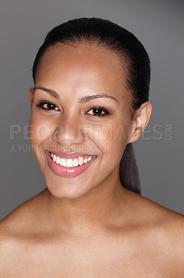 Buy stock photo Woman, portrait and smiling on gray studio background for skincare, beauty and facial cosmetics. Female person, dermatology and isolated on backdrop for aesthetic, glowing skin and wellness results.