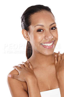 Buy stock photo Cropped shot of a beautiful young woman smiling happily while standing in a studio 