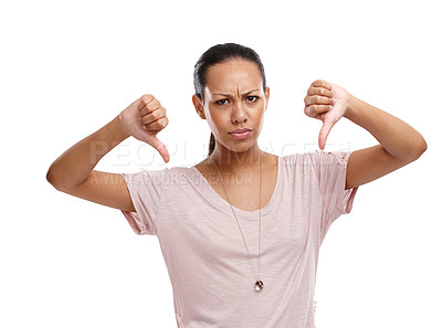 Buy stock photo Woman, upset and thumbs down with unhappy expression for disagreement, wrong or fail against a white background. Portrait of isolated female model showing down thumbs in disapproval, no or failure