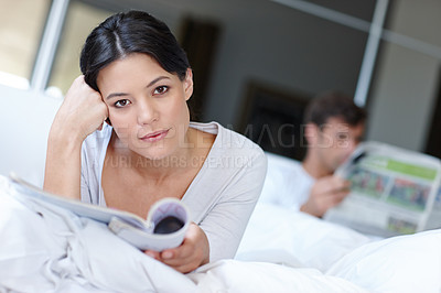 Buy stock photo Woman, thinking and portrait with magazine and boyfriend for contemplate future with article for rest in home. Mexican female person or girlfriend with book and idea thoughts with partner in bed