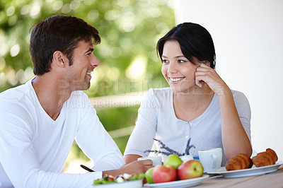 Buy stock photo Couple, balcony and outdoors together for meal, love and affection in marriage or romance in nature. People, nutrition and smile at breakfast for healthy relationship, food and relax on vacation