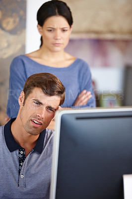 Buy stock photo Cropped shot of a young couple using a computer at home 