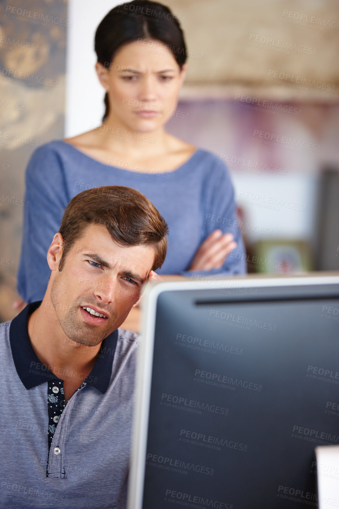 Buy stock photo Cropped shot of a young couple using a computer at home 