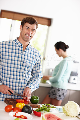 Buy stock photo Man, smile and portrait in kitchen with vegetable and girlfriend for food and cooking together healthy meal for detox. Boyfriend or young person and happy in house with ingredients for nutrition