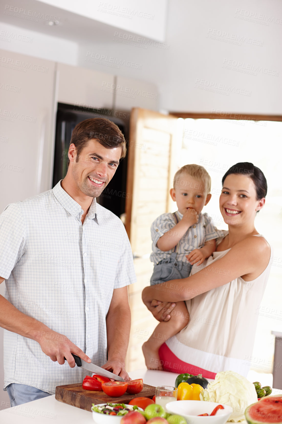 Buy stock photo Mom, father and child in kitchen portrait for eating fruits, vegetables or healthy food. Happy, people or family home together cooking meal for nutrition, development or teaching diet and wellness