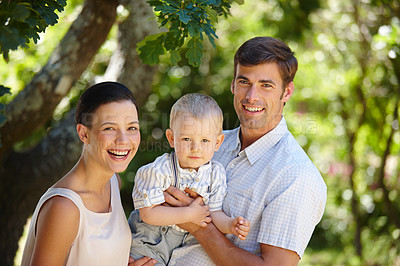 Buy stock photo Portrait of a mother and father spending time with their young son 