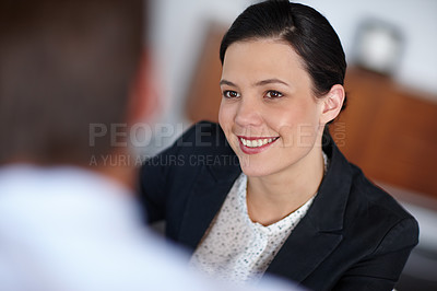 Buy stock photo Cropped shot of an attractive businesswoman sitting with an unrecognisable person 