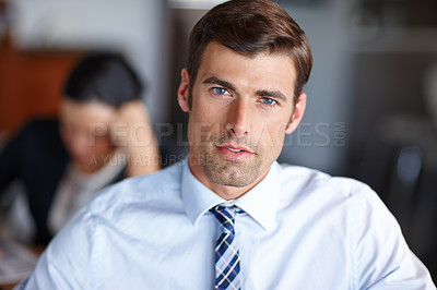 Buy stock photo Closeup portrait of handsome business man sitting in office. Businessman looking confident. Corporate professional, entrepreneur, leader, manager posing in office. The face of a focused employee