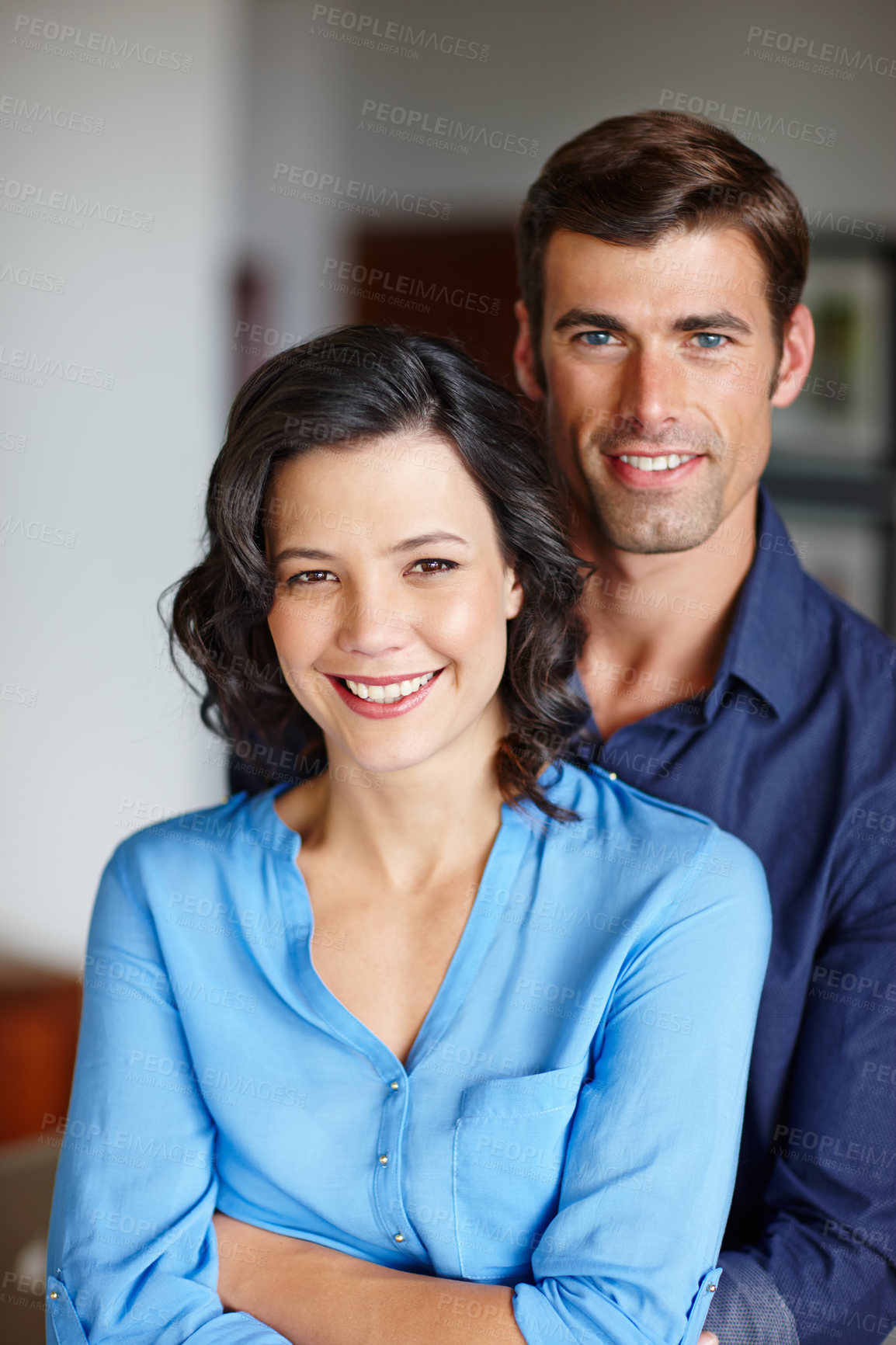 Buy stock photo Cropped shot of an affectionate couple spending time together in their home