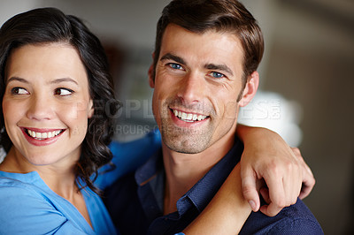 Buy stock photo Cropped shot of an affectionate couple spending time together in their home