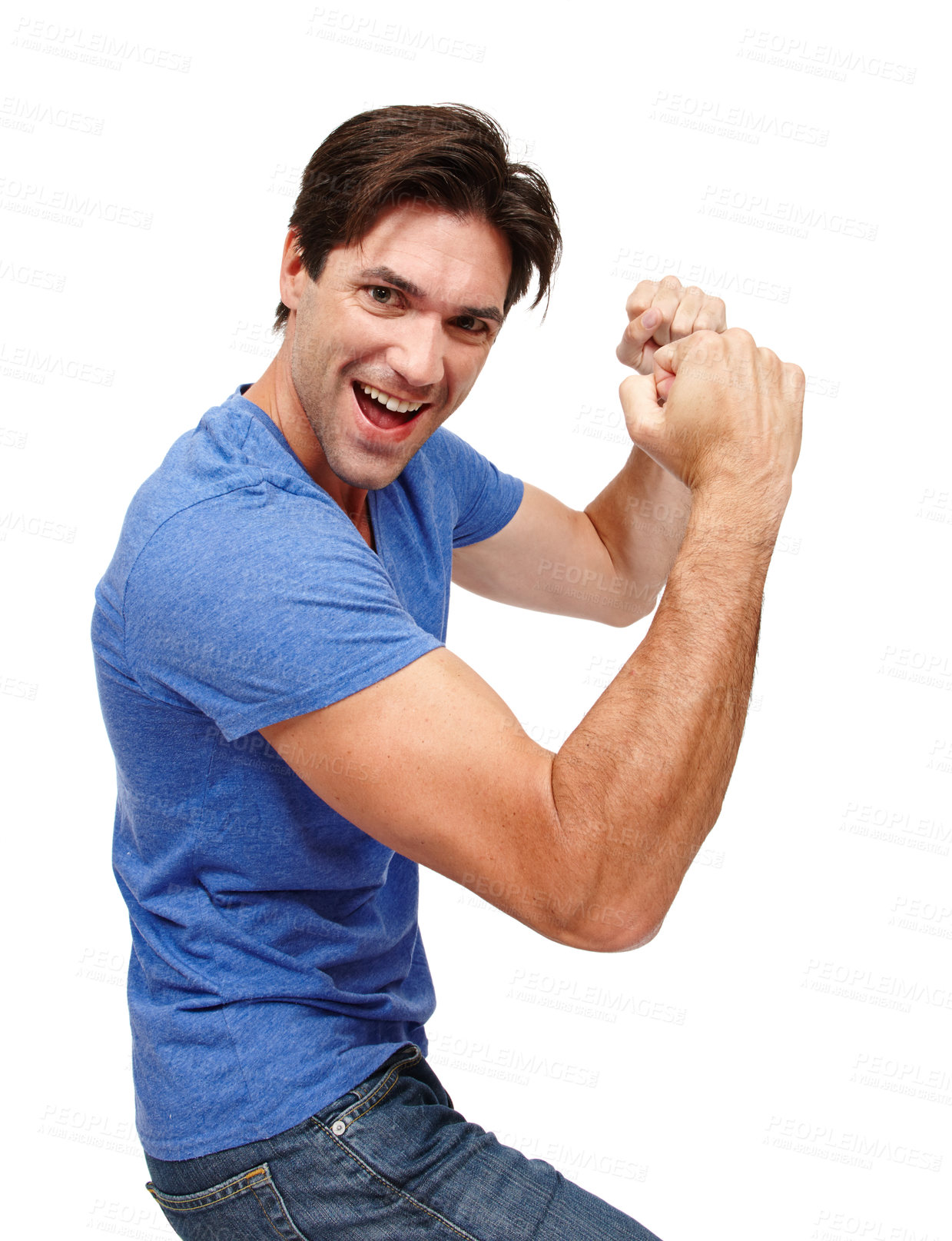 Buy stock photo Studio portrait of a handsome young man punching the air in excitement