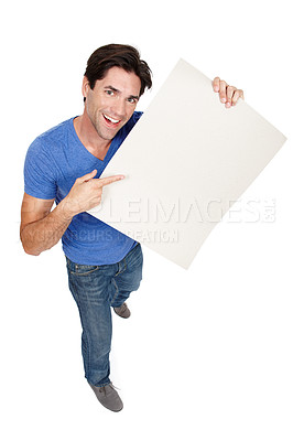 Buy stock photo Portrait, poster or happy man with a board for marketing, promotion or advertising deal in studio. Above, offer or male person with blank mockup space or paper isolated on white background for sales