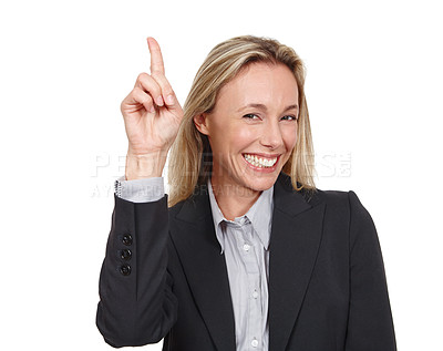 Buy stock photo Cropped studio portrait of an attractive businesswoman pointing up at copyspace