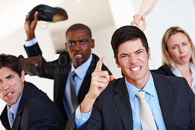 Buy stock photo Shot of an angry mob of business professionals