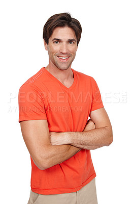 Buy stock photo Attractive caucasian man standing with his arms crossed and smiling at the camera while posing against a white studio background. Confident and positive male dressed in casual clothes