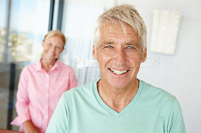 Buy stock photo Portrait,  senior man and woman in house with happiness, retirement and pensioner at home. Mature couple,  smile and indoor with relationship, together and married as family, connection and love
