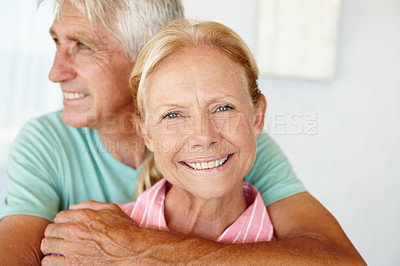 Buy stock photo Elderly, couple and portrait with smile or hug for support, commitment or healthy marriage and retirement. Senior, man and face of woman with happiness for embrace, home or affection in relationship