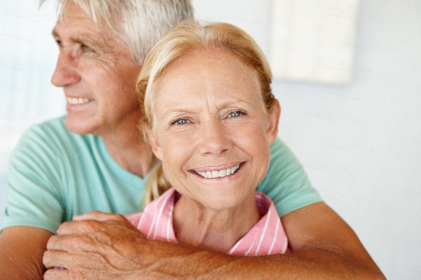 Buy stock photo Elderly, couple and portrait with smile or hug for support, commitment or healthy marriage and retirement. Senior, man and face of woman with happiness for embrace, home or affection in relationship