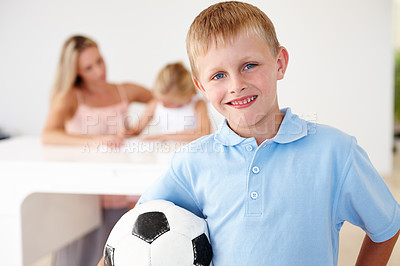 Buy stock photo Boy, football and smiling in portrait at home for after school summer sports, training and playing with friends. Child, happy and excited for fitness exercise, soccer practice or fun workout 