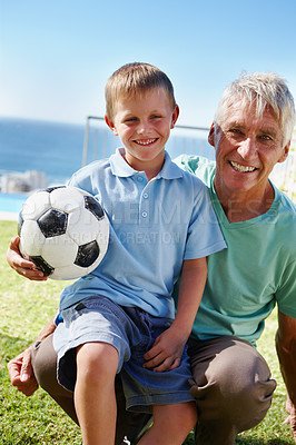 Buy stock photo Boy, football and grandfather smiling in portrait outdoor for bonding, development and retirement. Senior man, happy and child excited for family exercise, summer sports or  healthy play together