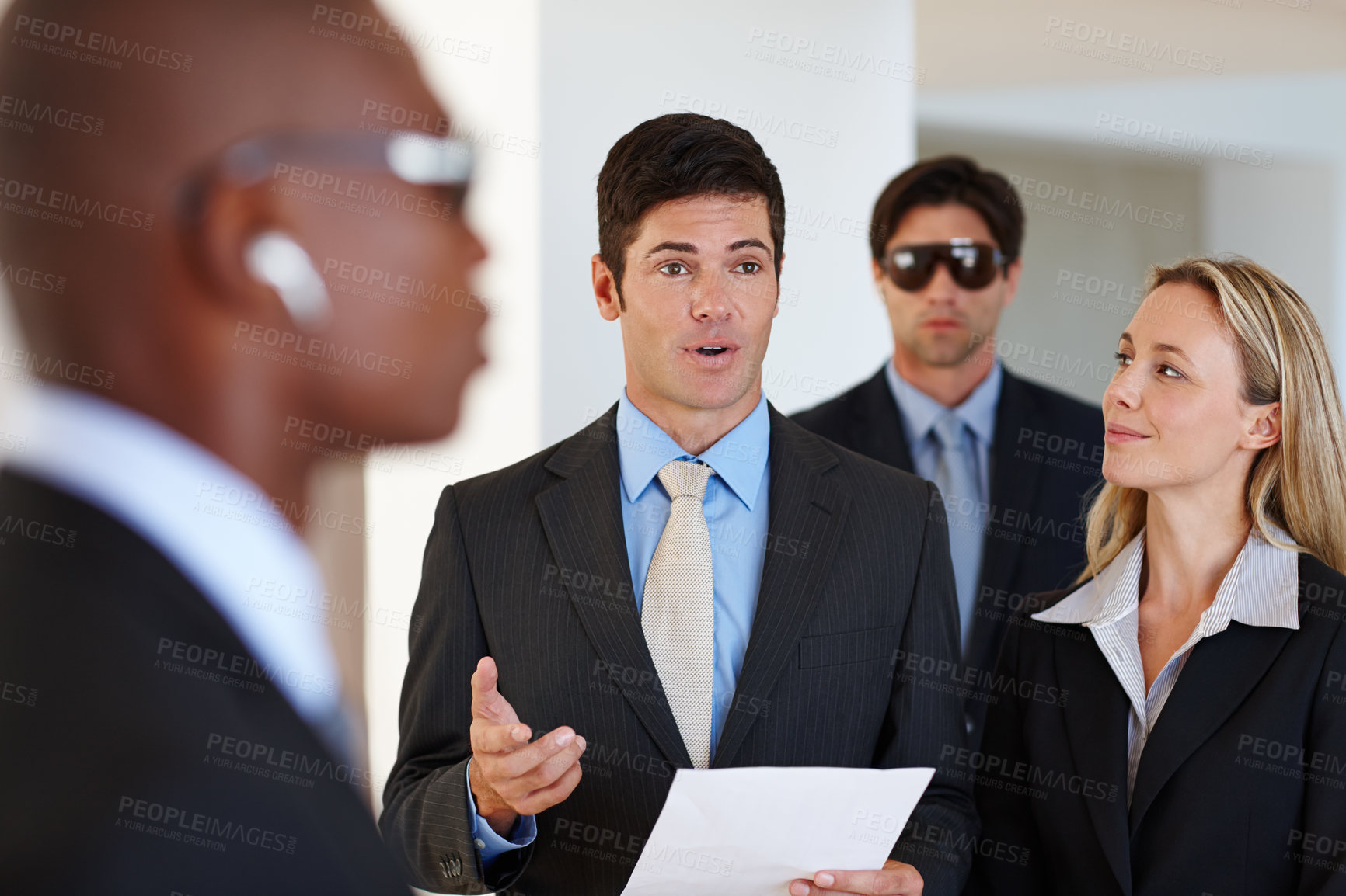 Buy stock photo Politician, speech and bodyguard for professional  presentation for political decision and info for crowd. Leader or representative with security and partner to talk with document for project  