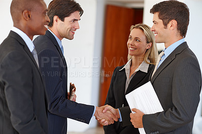 Buy stock photo Shot of two business colleagues shaking hands