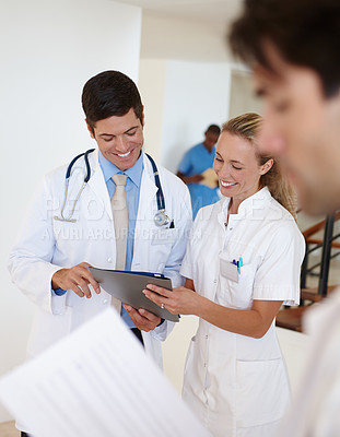 Buy stock photo Doctor, nurse and discussion in teamwork on report, charts and feedback on patient results in hospital. Clinic, employees and review the medical records, healthcare and check information on diagnosis