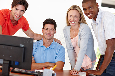 Buy stock photo Portrait of a group of designers working together in front of a computer