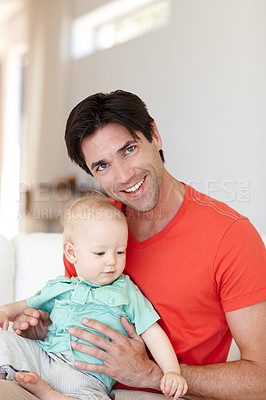 Buy stock photo Father, toddler and hug on couch portrait, love and bonding for child development in home. Happy daddy, boy and embrace for affection or single parent, comfort and security in connection on sofa