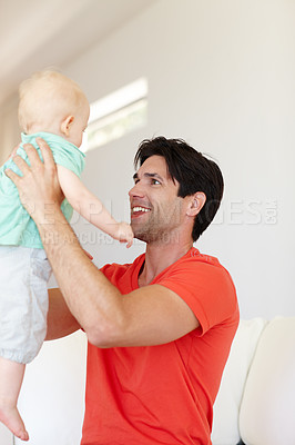 Buy stock photo Father, toddler and hug for play on couch, love and bonding for child development in home. Daddy, boy and embrace in game or single parent on sofa, comfort and security in connection in living room