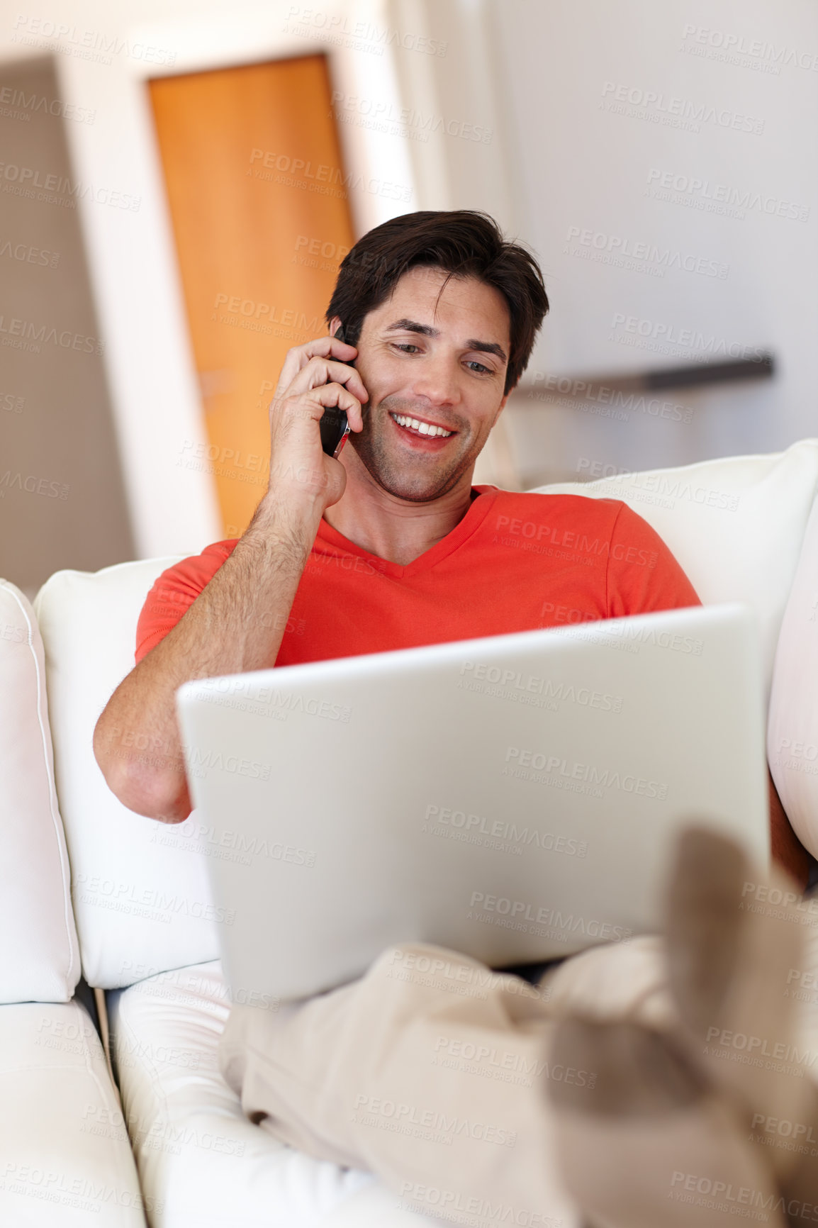 Buy stock photo Man, talking or phone call in living room with laptop for business, entertainment or work from home. Person, notebook and mobile happy for communication, deal or conversation with network provider