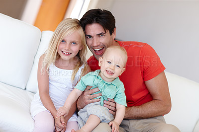 Buy stock photo Portrait, father and children with generations at family house by embrace, bonding and love in living room on couch. Dad, girl and toddler on vacation together on sofa at childhood home for memory
