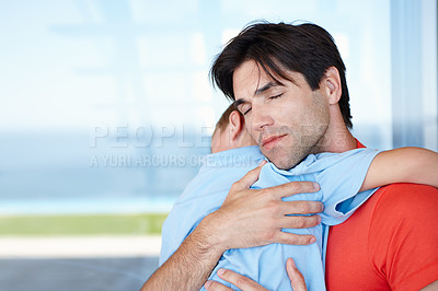 Buy stock photo Father, son and hug in embrace for support, development and growth with eyes closed at home. Male person, child and love for childcare, parenthood and relationship in family, bonding and youth