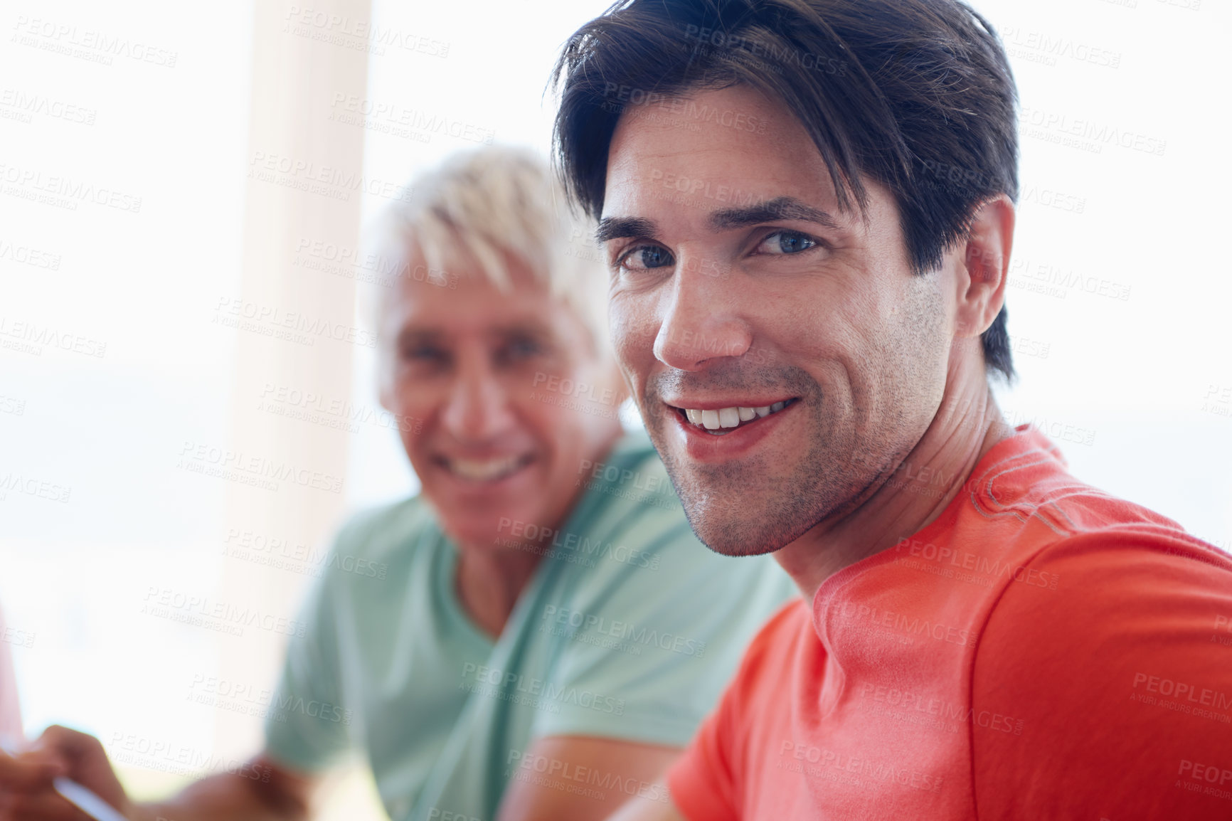 Buy stock photo Portrait, man and senior man in living room with smile, joyful and cheerful at home as family. Male people, happy and relationship for father and son, bonding and support in house for togetherness