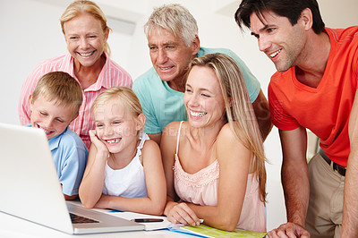 Buy stock photo Happy, family and grandparents in lounge on laptop with children for entertainment at home for development. Parents, siblings and bonding on vacation to visit grandma, grandpa and childhood house
